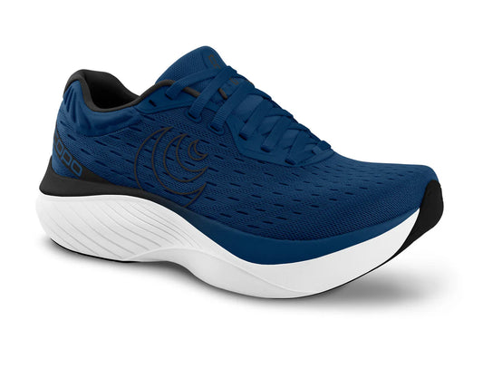 A navy and white Topo running shoe with a roomy toe box and a rockered sole designed for comfort and stability.