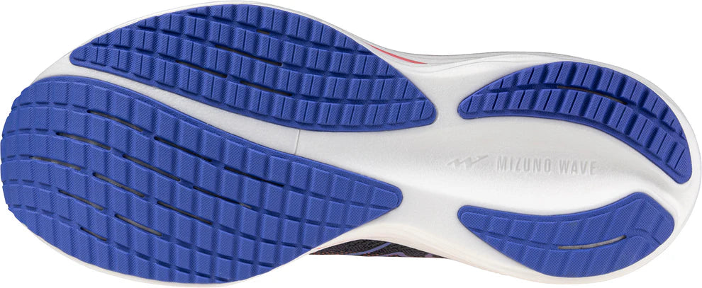 Close-up of a shoe sole with blue tread pattern on a white background