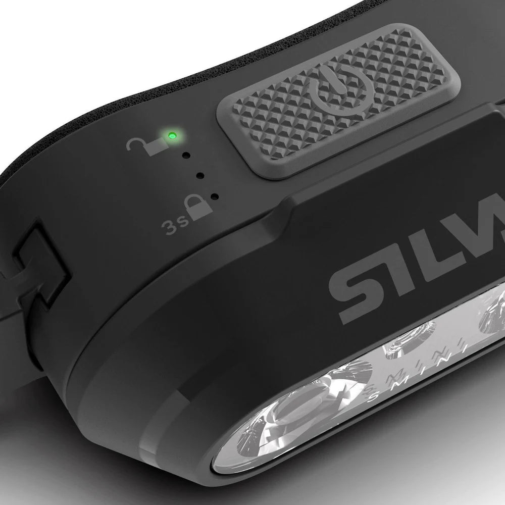 Close-up of a black Silva flashlight on a gray background