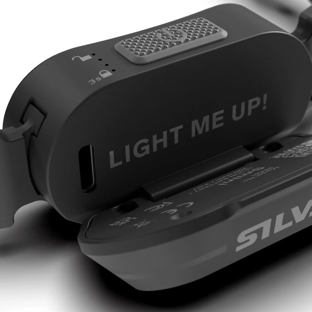 Black Silva device with 'LIGHT ME UP!' text on a gray background
