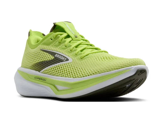 Green running shoe with 'Brooks' branding on a white background