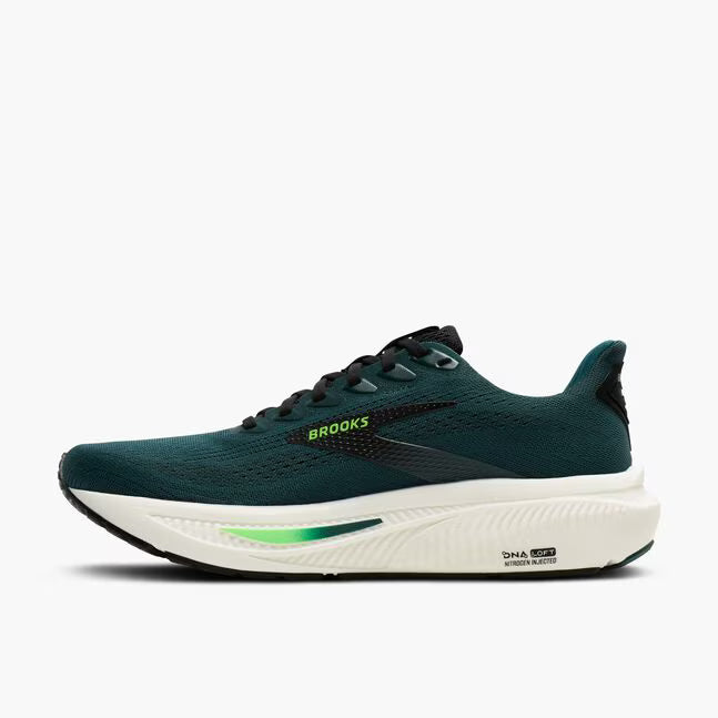 Green running shoe with white sole on a white background