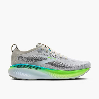 Gray running shoe with green sole on a white background