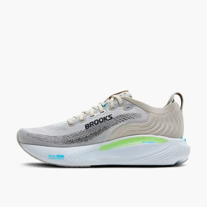 Gray running shoe with green sole on a white background