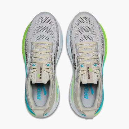 Pair of gray running shoes with green accents on a white background