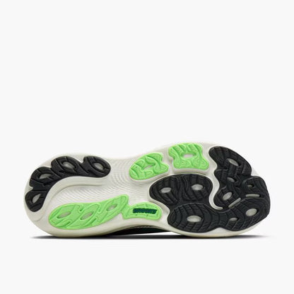 Close-up of a shoe sole with green and black patterns on a white background