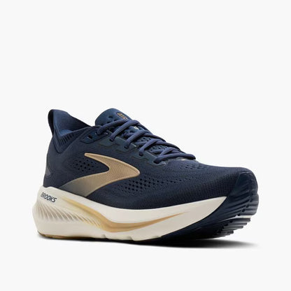 Navy running shoe with beige accents on a white background