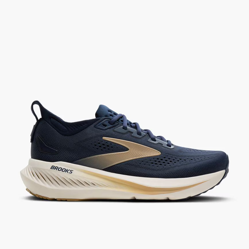 Navy running shoe with beige accents on a white background