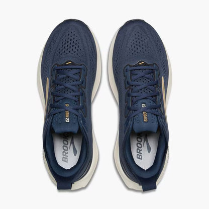 Pair of blue running shoes with white soles on a white background