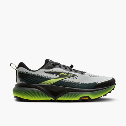 Brooks running shoe with green sole on a white background