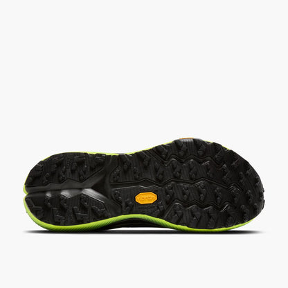 Black and green sole of a shoe on a white background