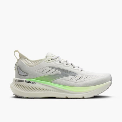 White running shoe with green sole on a white background