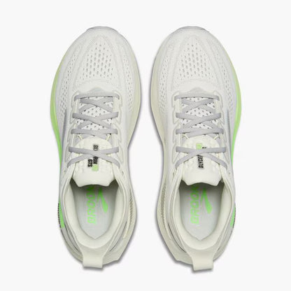 White running shoes with green accents on a white background