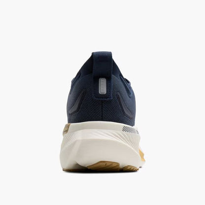 Navy running shoe with white sole on a white background
