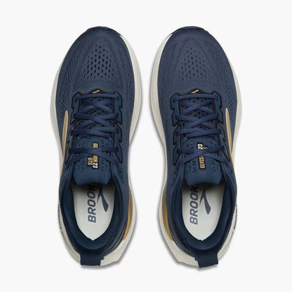 Pair of blue running shoes with white soles on a white background