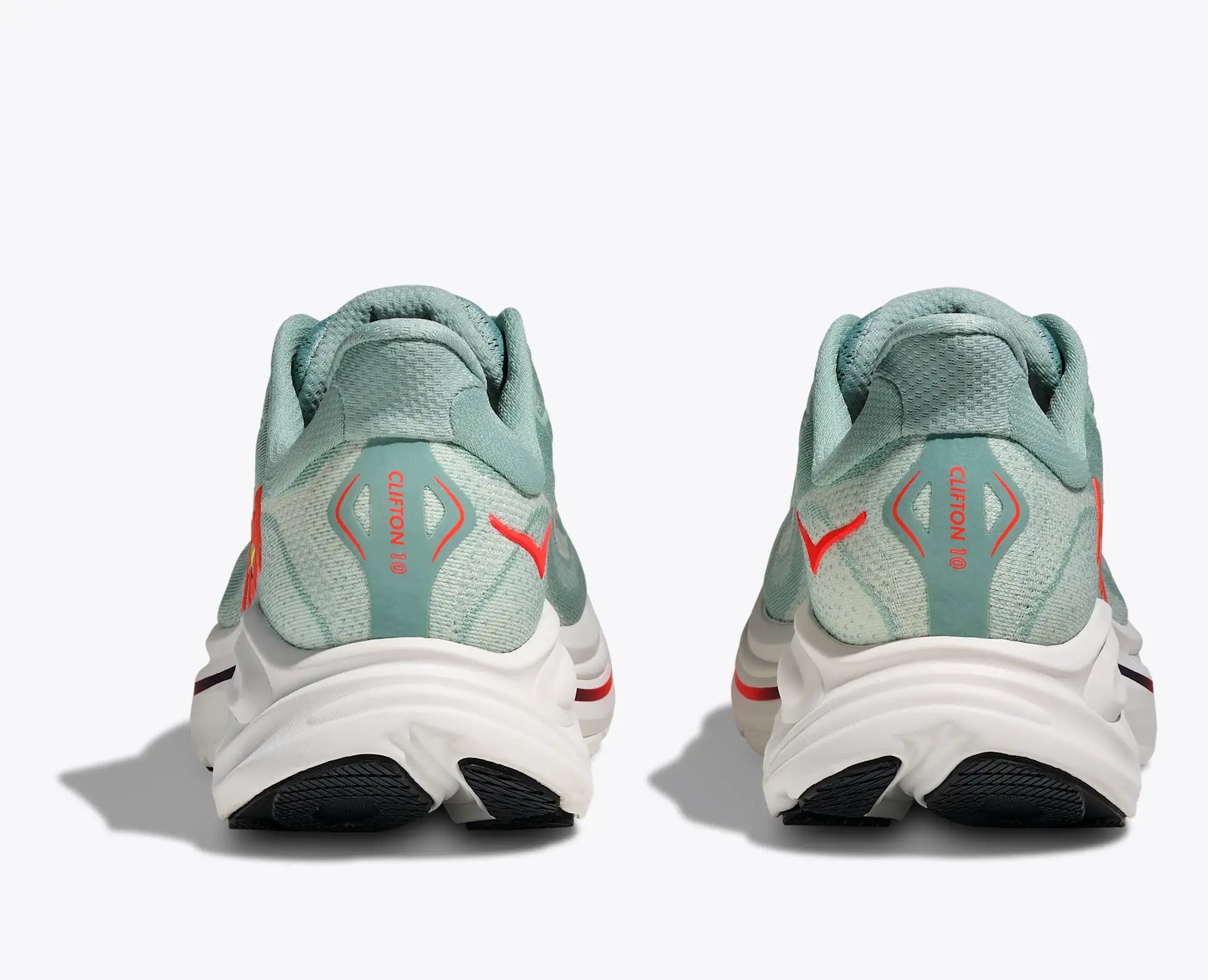 Pair of light blue Hoka Clifton 10 men's  running shoes with red accents on a white background