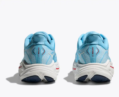 Pair of blue running shoes with white soles on a white background