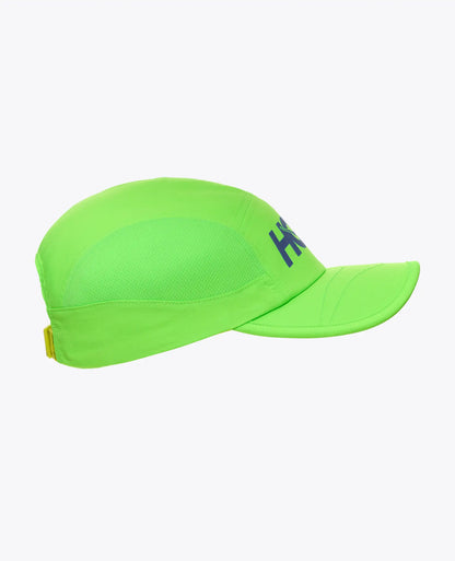 Green Hoka cap with a logo on a white background