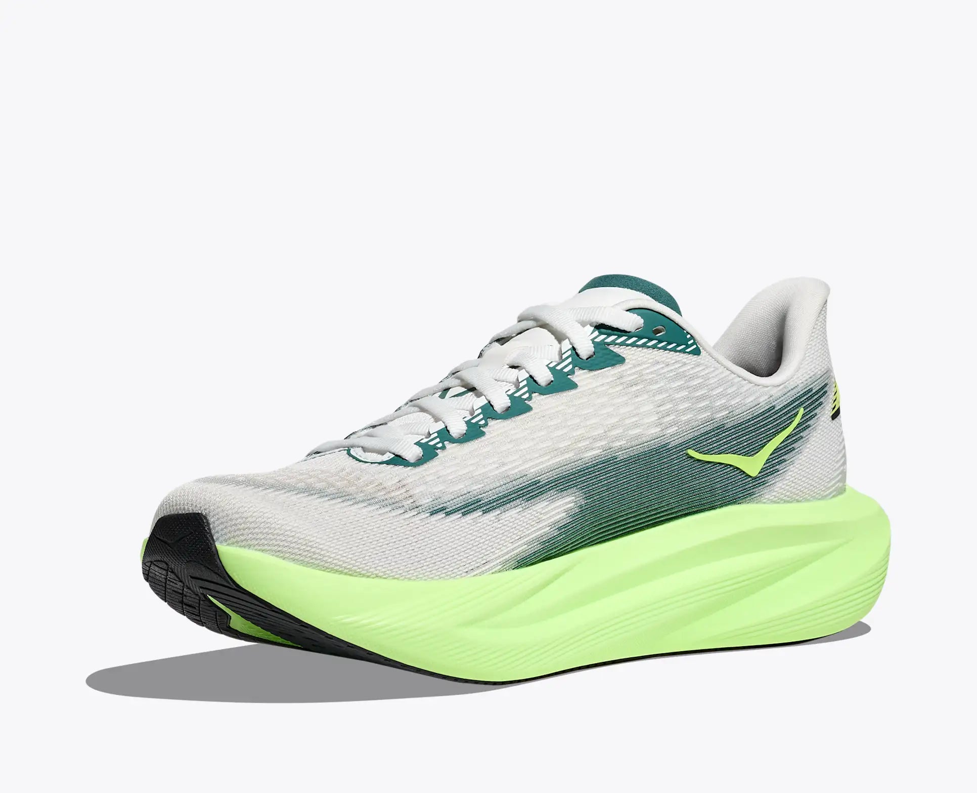 White running shoe with green accents on a white background