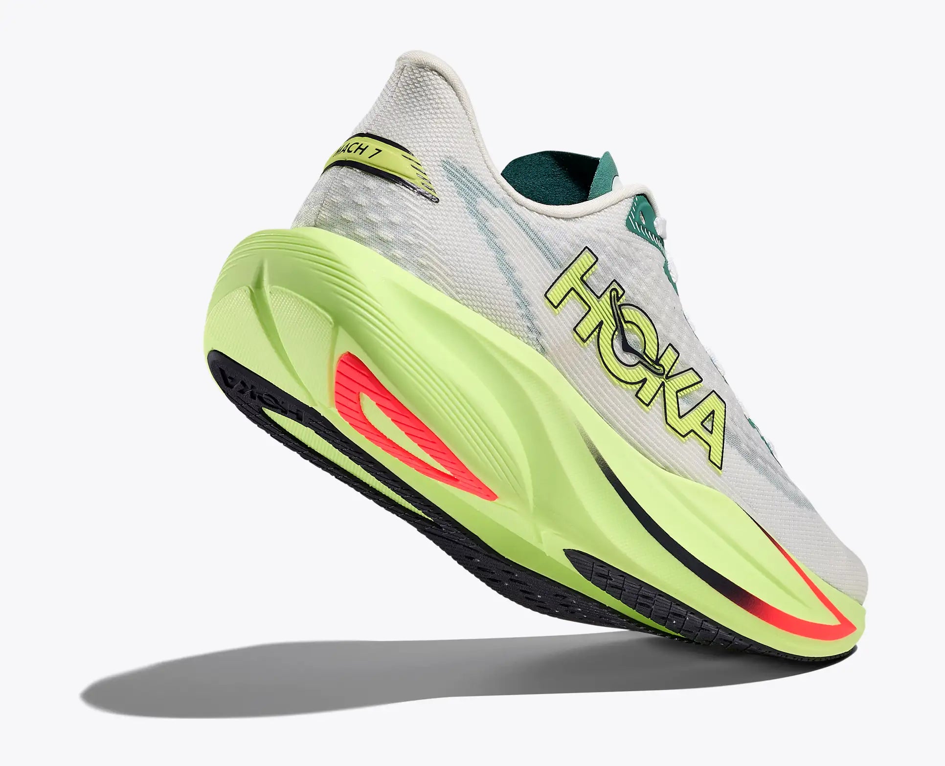 Hoka running shoe with a white and gray sole and green and red accents on a white background