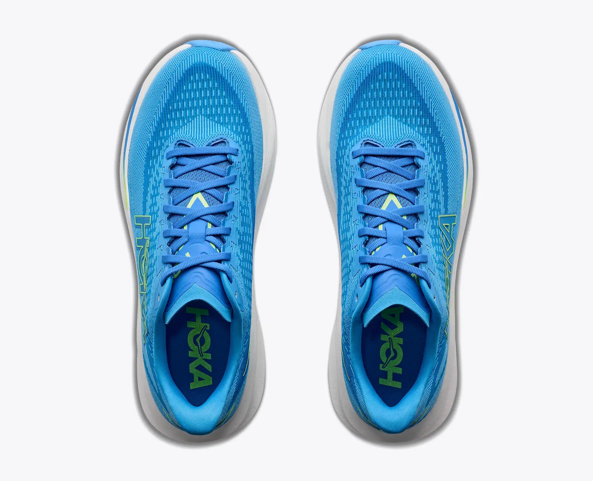 A pair of Hoka Mach 7  running shoes in bright blue and light blue, viewed from a top-down angle on a light gray background.