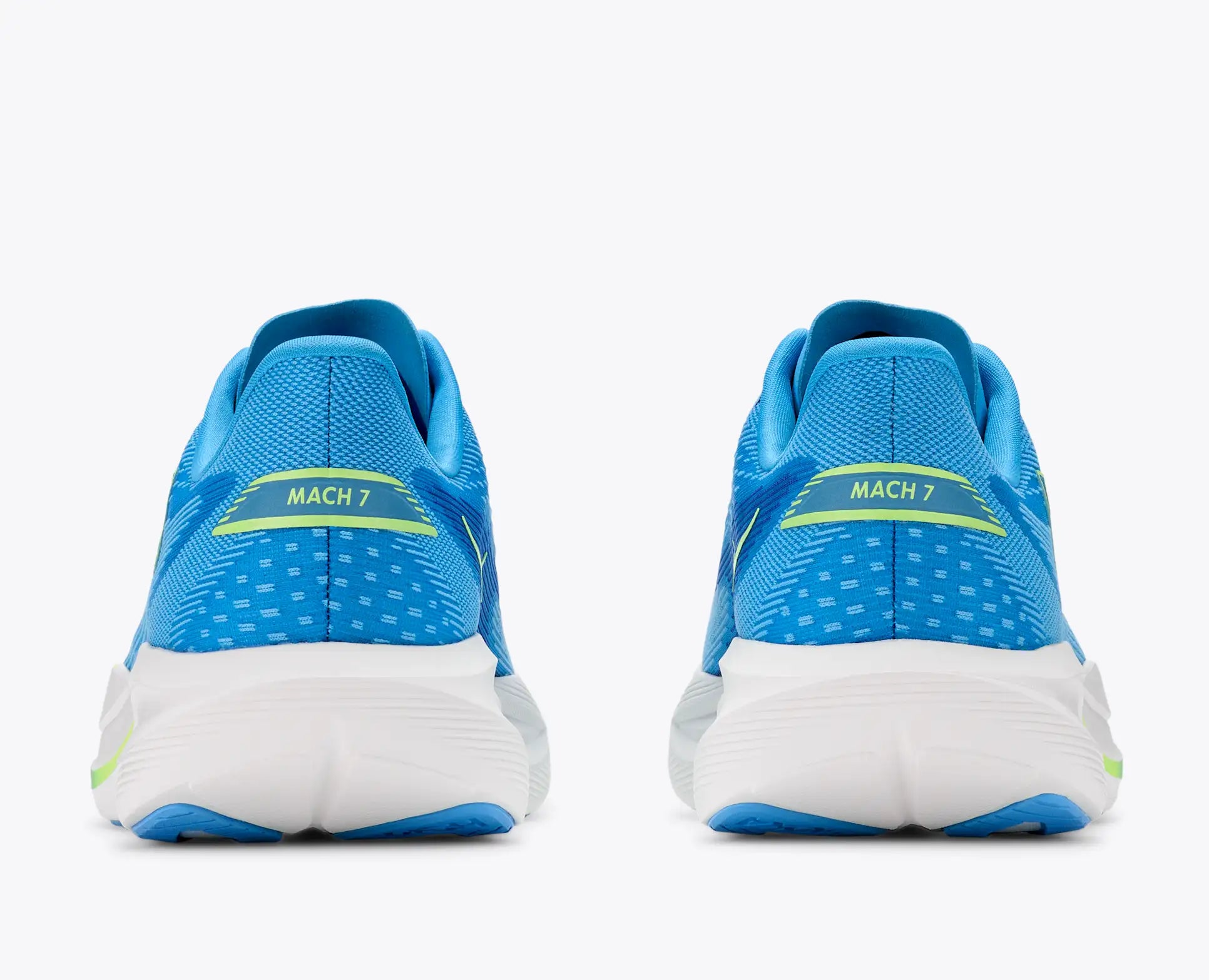A pair of blue and white Hoka Mach 7  running shoes shown from the back, featuring a blue mesh upper with a dotted pattern, a white midsole, and a yellow-green accent line with 'MACH 7' text on the heel.