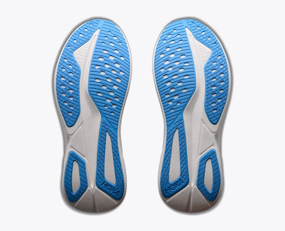 The outsoles of a pair of Hoka Mach 7  running shoes, showing the textured blue and white tread pattern against a light gray background.