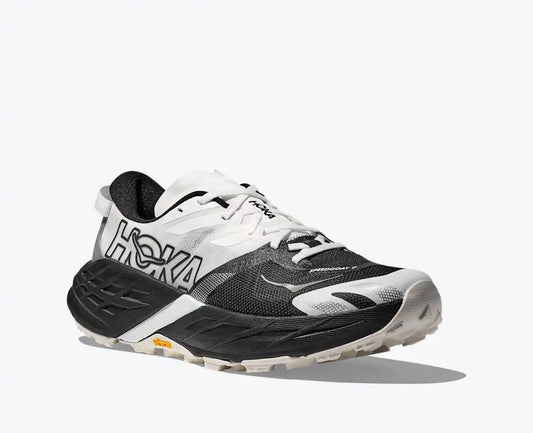 Black and white running shoe with 'Hoka' branding on a white background