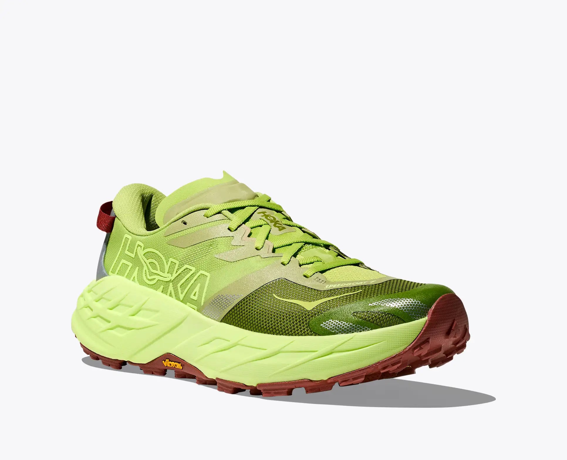 Bright green running shoe with red sole on a white background