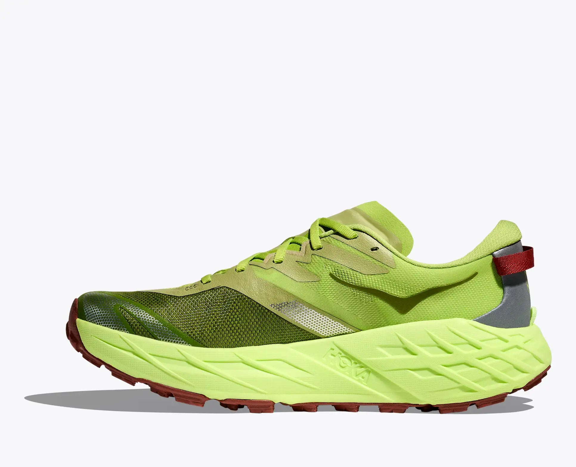 Green running shoe on a white background