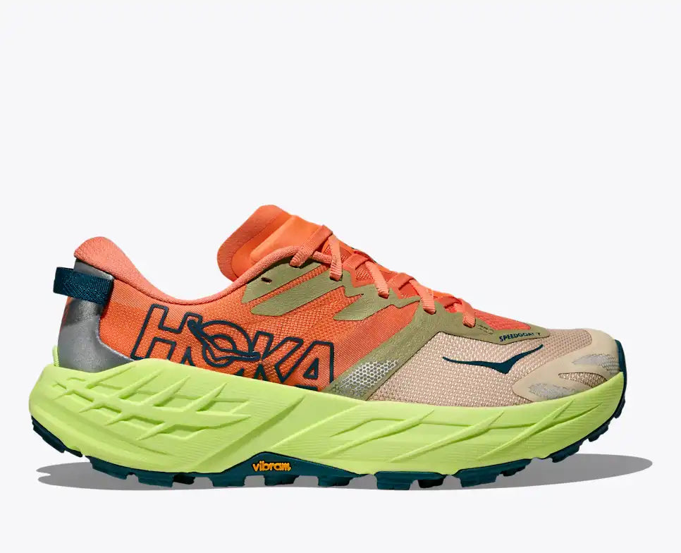 Orange and green running shoe with Hoka branding on a white background