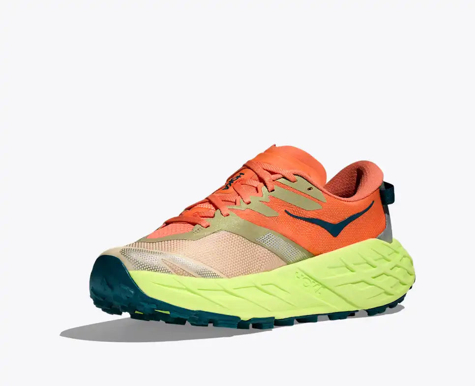 Orange and green running shoe on a white background