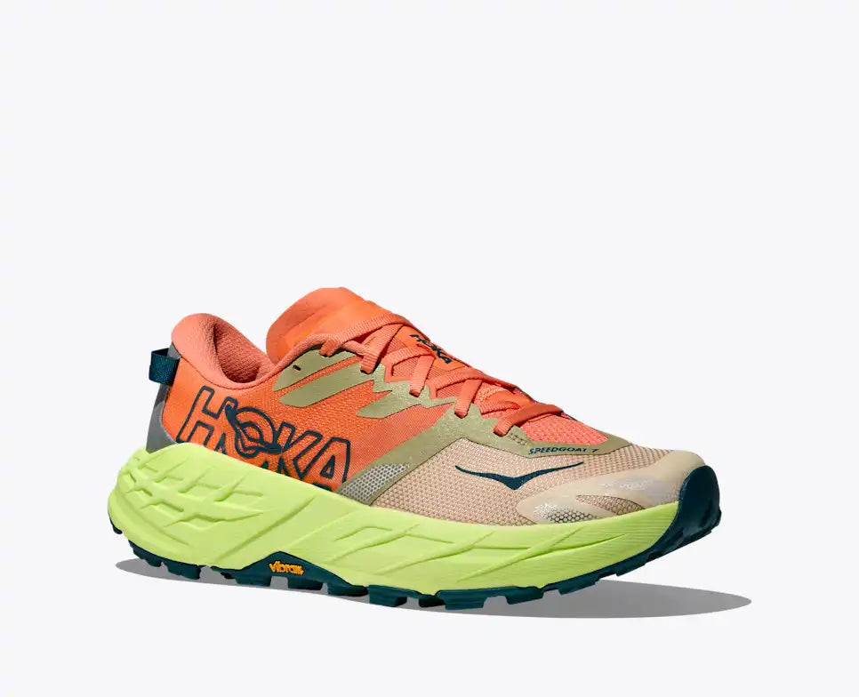 Orange and green running shoe with Hoka branding on a white background