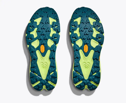 Close-up of blue and green sole pattern with brand logo on a white background