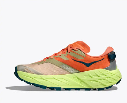Orange and green running shoe on a white background