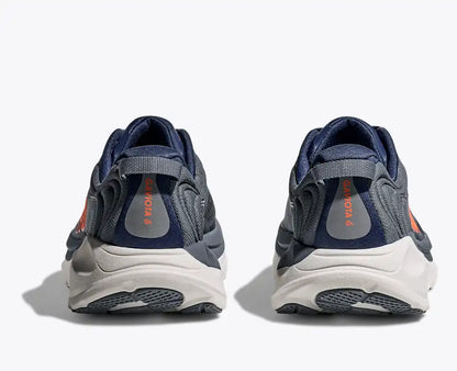 Grey Hoka running shoes on a white background