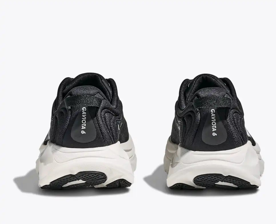 Black and white sneakers with 'Gaviota' branding on a white background