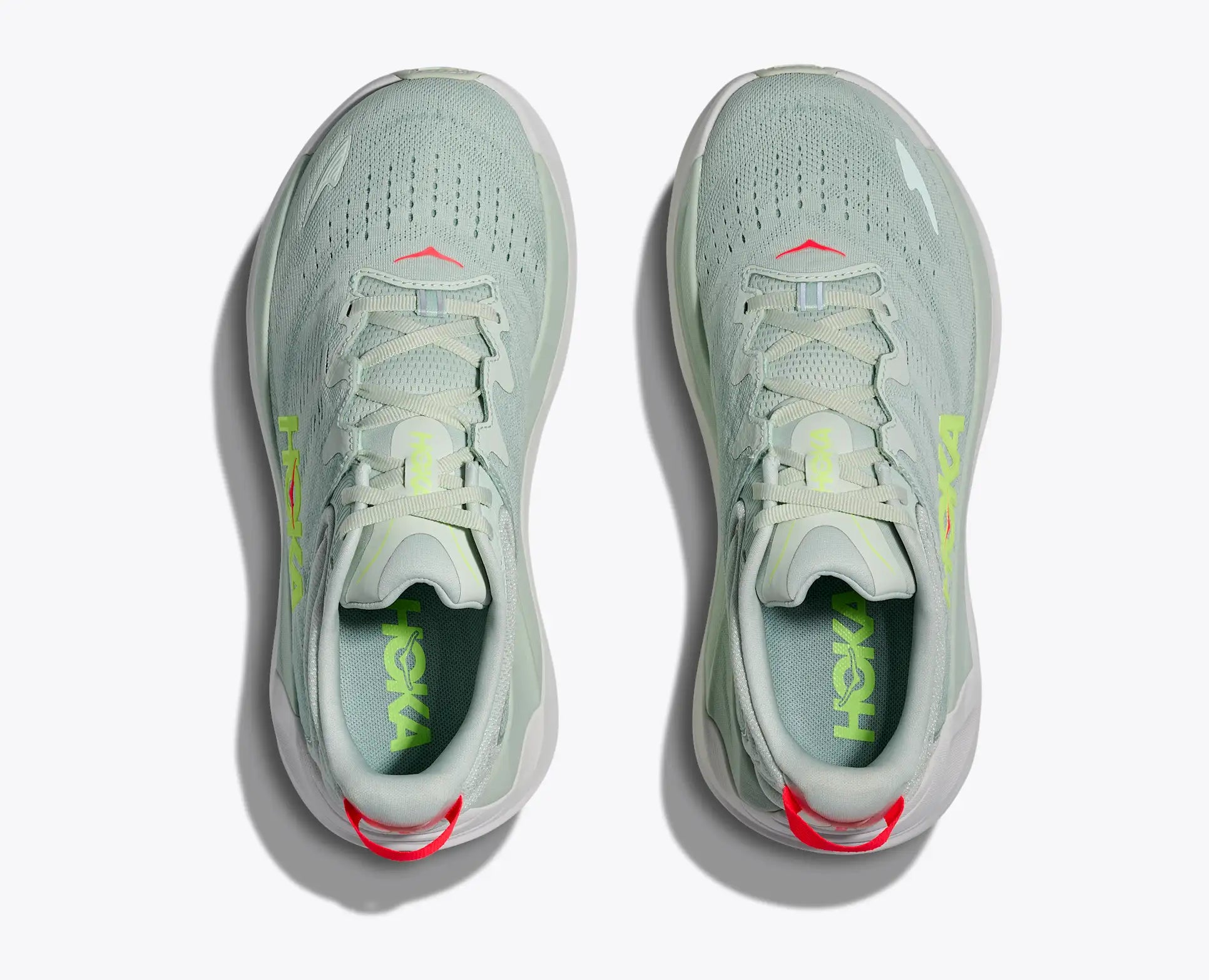 Light gray running shoes with red accents on a white background