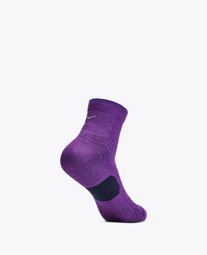 A single purple low-cut athletic sock with a black heel patch and a small white Nike swoosh logo, shown on a plain light gray background.