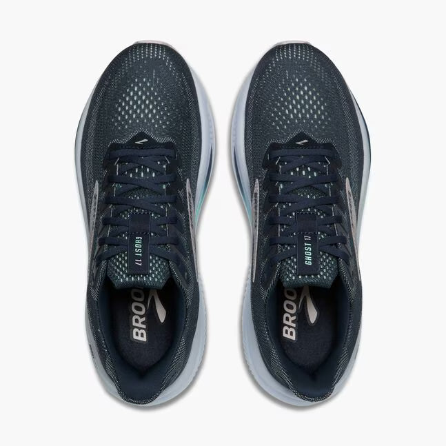 Pair of navy running shoes with gray soles on a white background