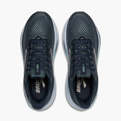 Pair of navy running shoes with gray soles on a white background