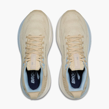 Pair of beige Brooks Women's Adrenaline GTS 25 running shoes with blue accents on a white background