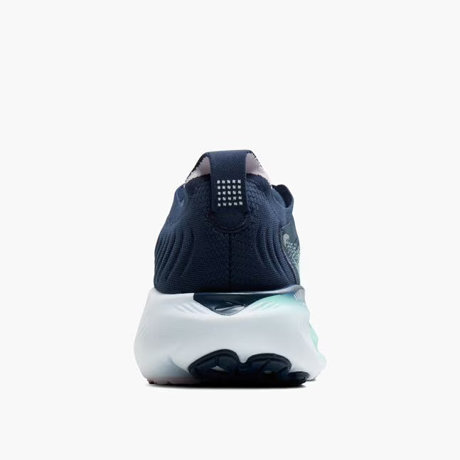 Navy blue sneaker with a white sole on a light gray background