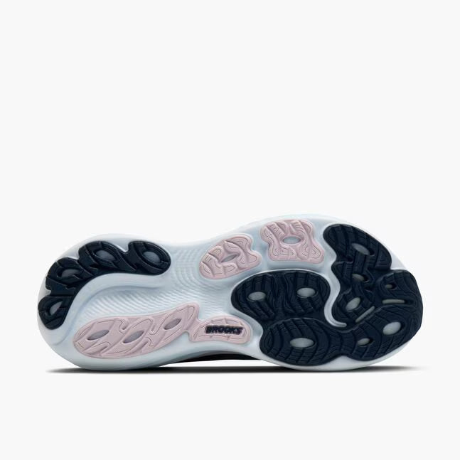 Close-up of a shoe sole with pink and black design on a white background