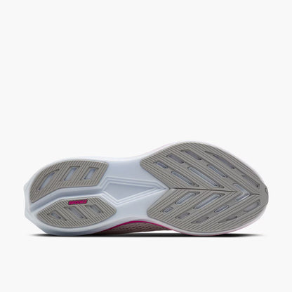 Sole of a running shoe with a white and gray sole design on a white background