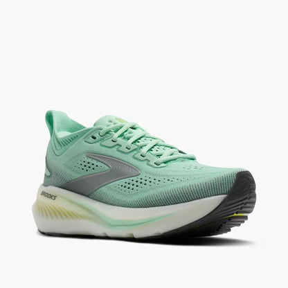 Green running shoe with a visible brand logo on a white background