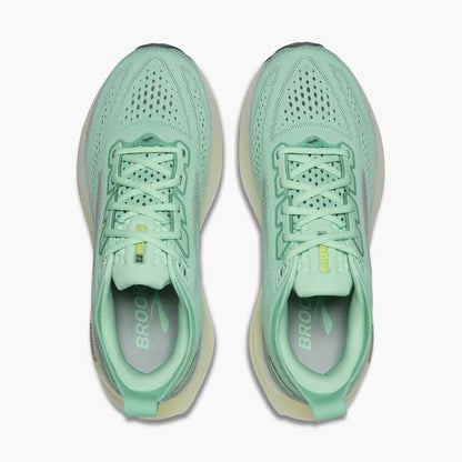Pair of light green running shoes on a white background
