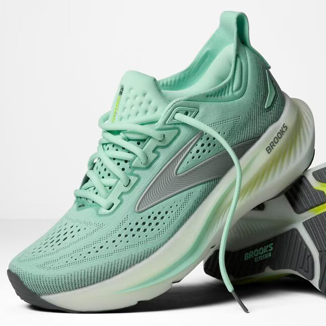 Mint green running shoe with Brooks logo on a white background