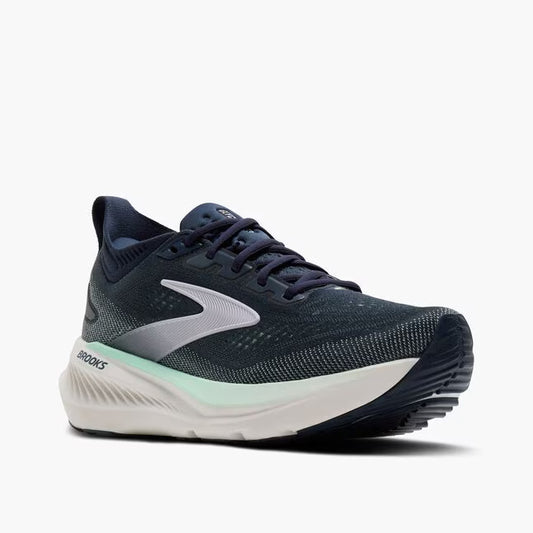Navy running shoe with white sole on a white background