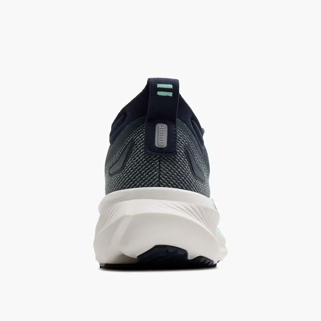Navy running shoe with white sole on a white background